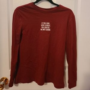 Thrifted red shirt top; solid red with writing in the front part